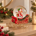 Palla di Neve Natalizia con Babbo Natale e Renna su Slitta Rossa e Oro – Collezione I Sogni dei Piccoli 17x12x20 cm